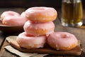 a stack of pink donuts