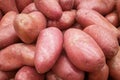Stack of pink potatoes on a market stall Royalty Free Stock Photo