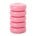 A stack of pink round things on white background Royalty Free Stock Photo