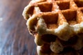 Stack of Plain Belgium Waffle on wooden surface. Royalty Free Stock Photo