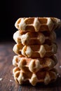 Stack of Plain Belgium Waffle on wooden surface. Royalty Free Stock Photo