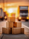 Stack of plain cardboard boxes on urban sidewalk with blurred truck and warm glowing sunset light in background symbolizing Royalty Free Stock Photo