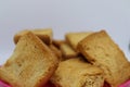 Stack of plain melba toasts on white Background. Edible square dry toast slices. Delicious crispbakes square cookies. Breakfast Royalty Free Stock Photo