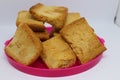 Stack of plain melba toasts on white Background. Edible square dry toast slices. Delicious crispbakes square cookies. Breakfast Royalty Free Stock Photo