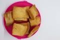 Stack of plain melba toasts on white Background. Edible square dry toast slices. Delicious crispbakes square cookies. Breakfast Royalty Free Stock Photo