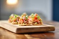 stack of plain, unfilled sopes on a wooden board