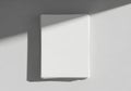 A stack of plain white paper is neatly placed on a flat surface. Soft shadows cast Royalty Free Stock Photo