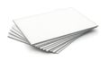Stack of plain white paper sheets arranged in a fan shape on a flat surface Royalty Free Stock Photo