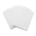 Stack of plain white paper sheets neatly arranged on a light background Royalty Free Stock Photo