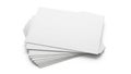 Stack of plain white paper sheets with a partially visible lined notebook underneath Royalty Free Stock Photo