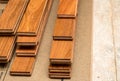 Stack of planks of brazilian Cherry hardwood flooring pieces ready for installation