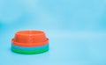 Stack plastic bowl for pet on blue background.