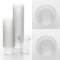 Stack of plastic cups and plates isolated on white background Royalty Free Stock Photo