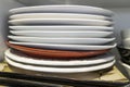 Stack of Plates in Kitchen cupborad at home Royalty Free Stock Photo