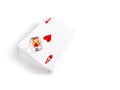 A stack of poker cards and transparent dice against a plain white background. Royalty Free Stock Photo