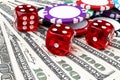 Stack of Poker chips with dice rolls on a dollar bills, Money. Poker table at the casino. Poker game concept. Playing a game Royalty Free Stock Photo