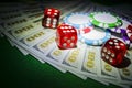 Stack of Poker chips with dice rolls on a dollar bills, Money. Poker table at the casino. Poker game concept. Playing a game with Royalty Free Stock Photo