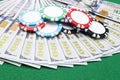 Stack of Poker chips on a dollar bills, Money. Poker table at the casino. Poker game concept. Playing a game with dice. Casino Royalty Free Stock Photo