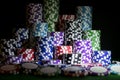 Stack of Poker chips on a green gaming poker table at the casino. Poker game concept. Playing a game with dice. Casino Concept for Royalty Free Stock Photo