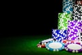 Stack of Poker chips on a green gaming poker table at the casino. Poker game concept. Playing a game with dice. Casino Concept Royalty Free Stock Photo