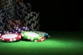 Stack of Poker chips on a green gaming poker table at the casino. Poker game concept. Playing a game with dice. Casino Concept Royalty Free Stock Photo