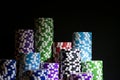 Stack of Poker chips on a green gaming poker table at the casino. Poker game concept. Playing a game with dice. Casino Concept