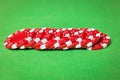 Stack of poker chips on a green table Royalty Free Stock Photo