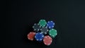 Stack of poker chips and two hands on table. Closeup of poker chips in stacks on green felt card table surface. Poker Royalty Free Stock Photo