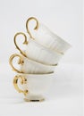 Stack of porcelain tea cups on white background Royalty Free Stock Photo