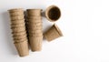 A stack of pots of peat for growing plants at home. The concept of a vegetable garden on the window. Fast-paced product in the Royalty Free Stock Photo