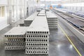 Stack of precast reinforced concrete slabs in factory workshop