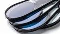 Stack of Precision Optical Lenses with Blue Coating Royalty Free Stock Photo