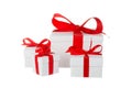 Stack of presents white gifts ribbon red bow isolated on white background Royalty Free Stock Photo