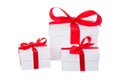 Stack of presents white gifts ribbon red bow isolated on white background Royalty Free Stock Photo