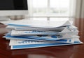 A stack of printed financial reports with charts and graphs, Royalty Free Stock Photo