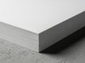 Stack of pristine white paper sheets on textured surface isolated on white background Royalty Free Stock Photo
