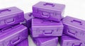 A stack of purple hard-shell suitcases with horizontal grooves. They are arranged Royalty Free Stock Photo
