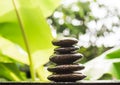 Stack pyramid stone zen pebbles nature on wooden with blur green Royalty Free Stock Photo