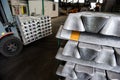 Stack of raw aluminum ingots in aluminum profiles factory