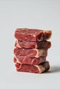 Stack of Raw Beef Steaks on White Background Royalty Free Stock Photo