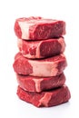a stack of raw beef steaks on a white studio background Royalty Free Stock Photo