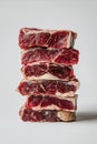 Stack of Raw Premium Beef Steaks on White Background Royalty Free Stock Photo