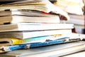 Stack of recycling paper on white. Pile of old books. Old open books close up Royalty Free Stock Photo