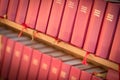 Stack of red bible books in church. Sweden, Europe