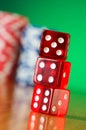 Stack of red casino dice against background Royalty Free Stock Photo