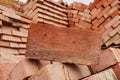 A stack of red clay bricks in rows close up. Royalty Free Stock Photo