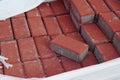 Stack of red concrete pavers in raffia bag outdoor Royalty Free Stock Photo