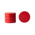 Stack of red cylinders next to a red disk Royalty Free Stock Photo