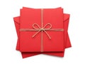 Stack of red envelopes with bow, isolated on white background Royalty Free Stock Photo
