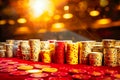 Stack of red and golden poker chips on casino game table